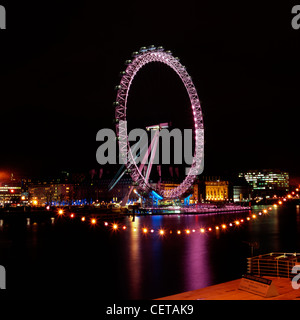 The London Eye at night. Opened in 1999, it stands 135m (443 ft) high making it is the largest observation wheel in the world.
