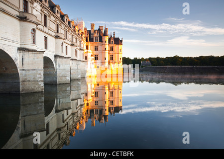 The chateau of Chenonceau reflecting in the river Cher at sunrise in France. It is in the UNESCO protected Loire Valley. Stock Photo