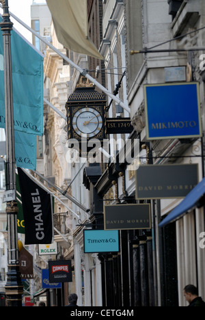 Shop signs in Old Bond Street. Bond Street takes its name from Sir Thomas Bond who purchased a Piccadilly mansion called Clarend Stock Photo