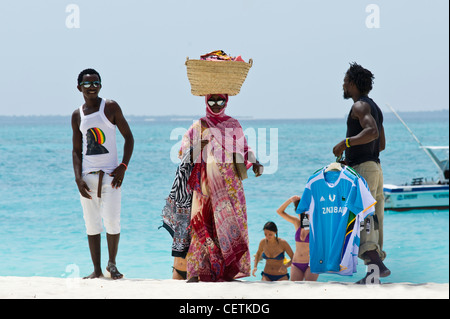 Salesmen on the beach of Kendwa Rocks north coast of Zanzibar Stock Photo