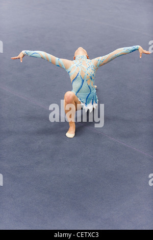 Female gymnast performing floor routine Stock Photo