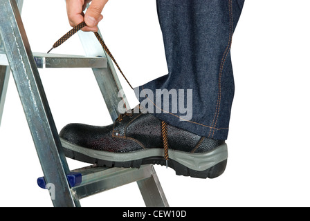 repairman lace his shoes on white background Stock Photo
