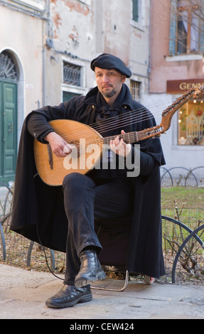 Traditional italian musician playing a lute in venice Stock Photo