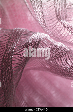 Pink mesh fabric textile texture close up Stock Photo