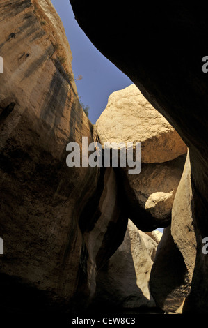 Rocks wedged into desert canyon walls. Stock Photo