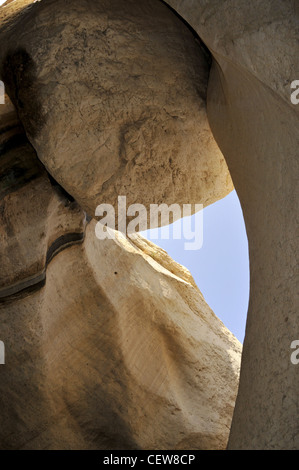 Desert scene: Large rock situated between canyon walls. Stock Photo