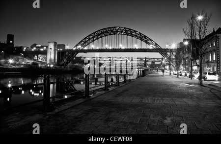 Black and white photograph of Tyne Bridge at night in Newcastle-upon-Tyne, in Newcastle's popular quayside distrct Stock Photo