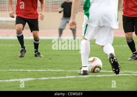 Soccer players on field, cropped Stock Photo