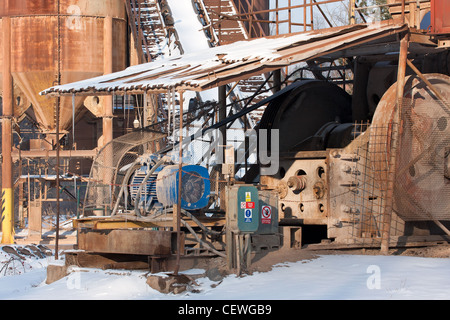 Gravel pit, Belt conveyors and electric motor in winter Stock Photo