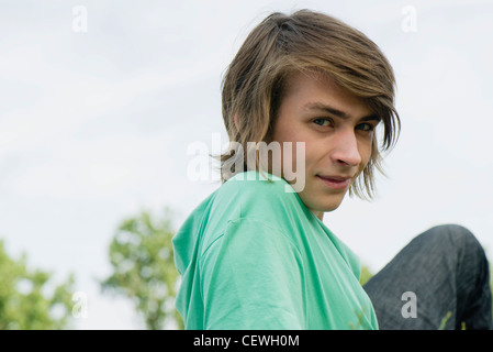 Young man relaxing outdoors, portrait Stock Photo