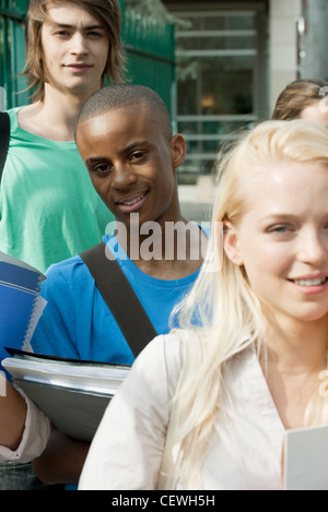 Male university student among friends Stock Photo