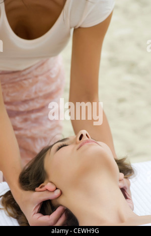 Young woman receiving massage Stock Photo