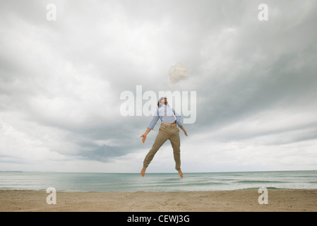 Young man jumping in air Stock Photo