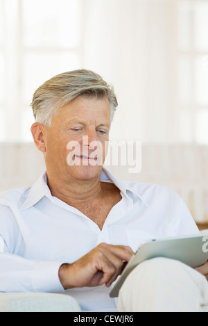 Senior man using digital tablet Stock Photo