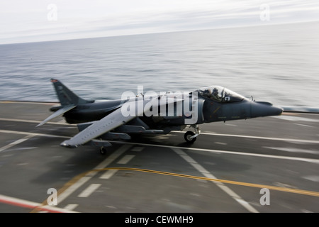Harrier jet landing on naval aircraft carrier HMS Illustrius