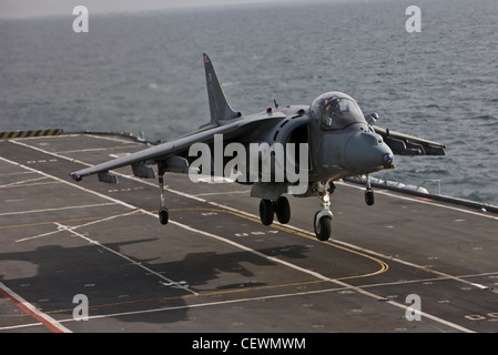 Harrier jet landing on naval aircraft carrier HMS Illustrius