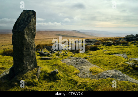 Standing stone and view to the south at Great Links Tor on Dartmoor, Devon Stock Photo