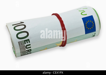 Many 100 Euro bills, rolled up and held together with a rubber. On January 01st 2002 the Euro was introduced as cash. Stock Photo