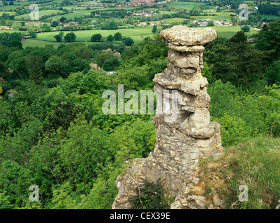 The Devils Chimney, a limestone rock formation that stands above a disused quarry in Leckhampton. Stock Photo