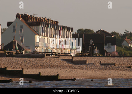 A view of a seaside terrace of houses on the beach at Whitstable Stock Photo