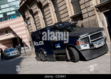 Financial fools day in the City.  Protestors take to the streets and riot police are deployed with Jankel Guardian armoured car Stock Photo