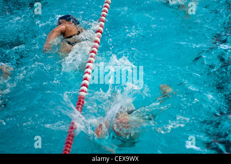 People swim in a public pool in Wehrheim near Frankfurt, Germany