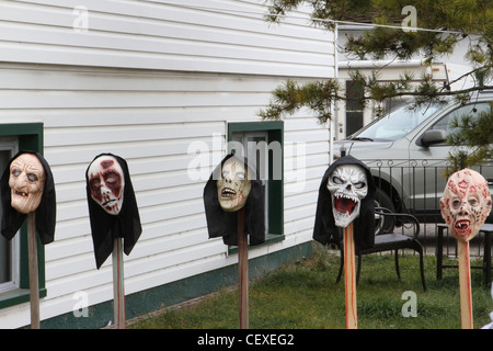 Scary Halloween masks in the front yard Stock Photo