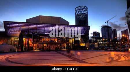 Lowry Centre Salford Quays Theatre, front view at dusk, Media City Construction at rear Stock Photo