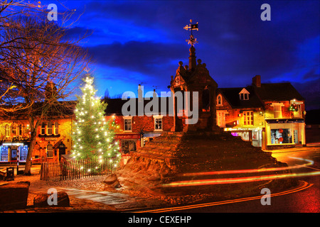 Xmas scene at the Christmas Tree at Lymm Cross, Lymm village, Cheshire, England, UK Stock Photo