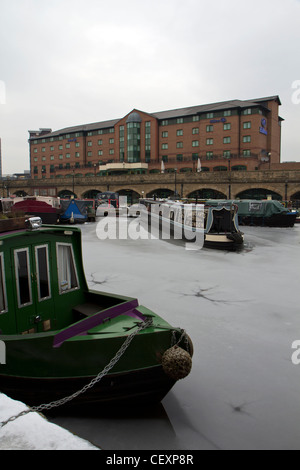 Canal barges frozen in ice after cold weather Sheffield Victoria Quays South Yorkshire England Stock Photo