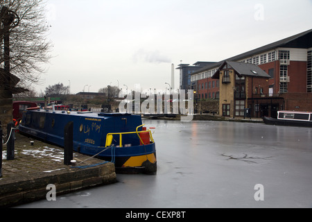 Canal barges frozen in ice after cold weather Sheffield Victoria Quays South Yorkshire England Stock Photo