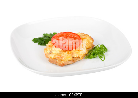 Roasted pork steak baked with cheese and tomato Stock Photo