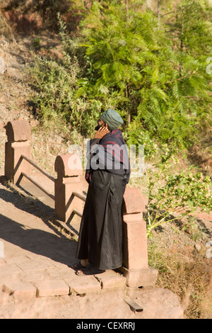 Priest at the rock hewn Church of St George Bet Giyorgis in  Lalibela in Ethiopia Stock Photo