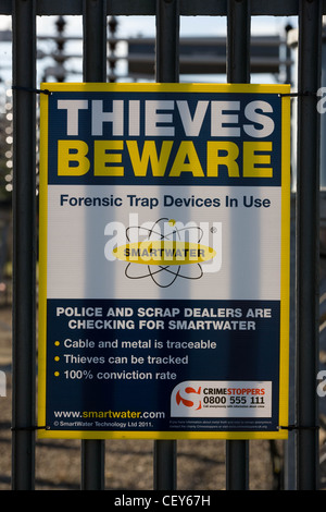 Thieves Beware Sign warning of smartwater use in regard to metal theft Stock Photo