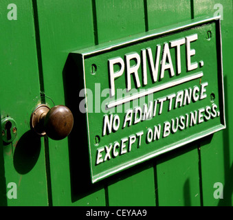 Private No Admittance Except On Business GWR Great Western Railway sign on a green door. Woody Bay, North Devon, England UK Stock Photo