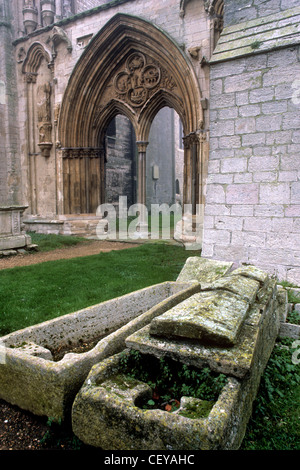 UK, Lincolnshire, Crowland, Croyland Abbey, medieval stone coffins in misty graveyard Stock Photo