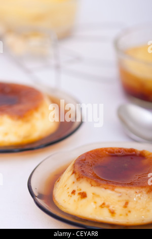 Flan: Sweet custard with a caramel topping. Pudding. Vanilla flavour.  Caramel, known as 'flan' in the US and Spanish. Stock Photo