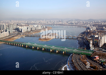 The Han River and bridges with the city skyline in Seoul, South Korea Stock Photo