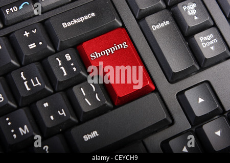 Keyboard with selective focus on the enter button saying Shopping Stock Photo