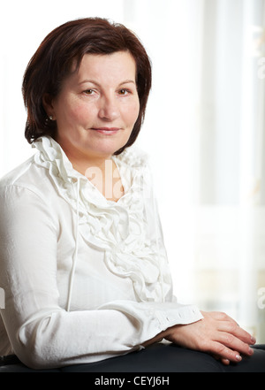50 year old beautiful business woman portrait at the office. Stock Photo