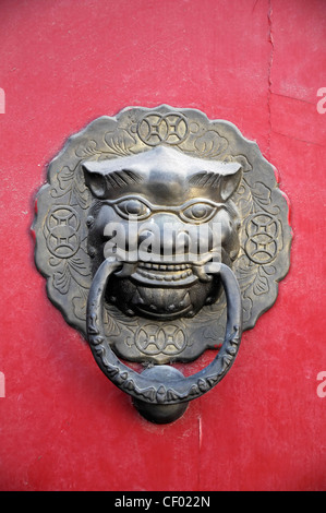 Detail detailed heavy bronze stud studded red door gate entrance decorative gilt knocker Forbidden City Beijing China Stock Photo