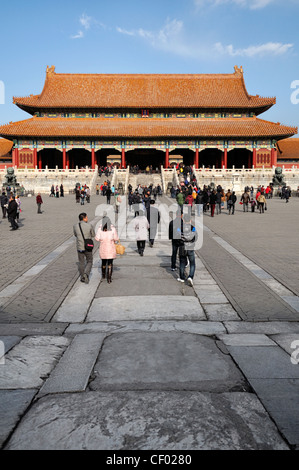 tourists inside in the first courtyard outside leading to gate of supreme harmony forbidden city palace museum beijing china Stock Photo