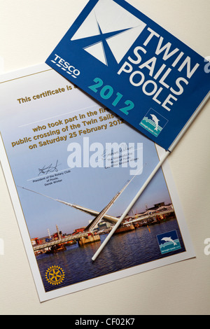 Certificate and flag - mementos of the public crossing of the new twin sails lifting bridge in Poole, Dorset on 25 February 2012 opening ceremony Stock Photo