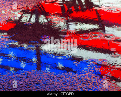 American flag reflection in a puddle Stock Photo