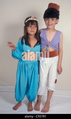 boy and girl dressed in Aladdin costumes Stock Photo