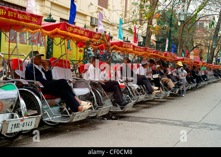 Row of pedicabs in Hanoi Vietnam Stock Photo