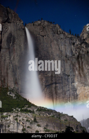 Lunar Rainbow reflection, also known as a moonbow, appears under moonlight over Yosemite Falls - Yosemite National Park Stock Photo