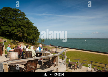 UK, England, Isle of Wight, Norton Grange, Warners Coastal Resort, visitors on terrace overlooking the Solent Stock Photo