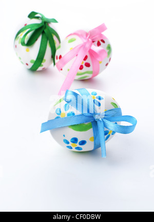 Easter eggs with bows over white background Stock Photo - Alamy