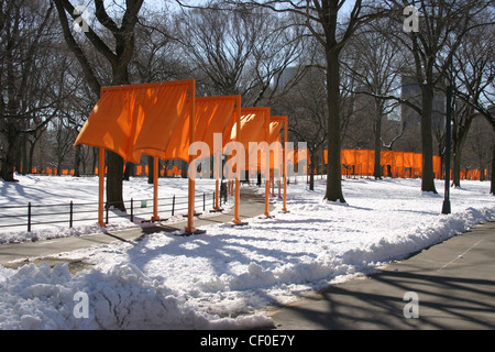 Saffron coloured gates .  Christo and Jeanne-Claude gate exhibition Central Park, New York Stock Photo